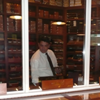 A Customer Selects from a Wide Array of Premium Cigars for His Lunchtime Smoke